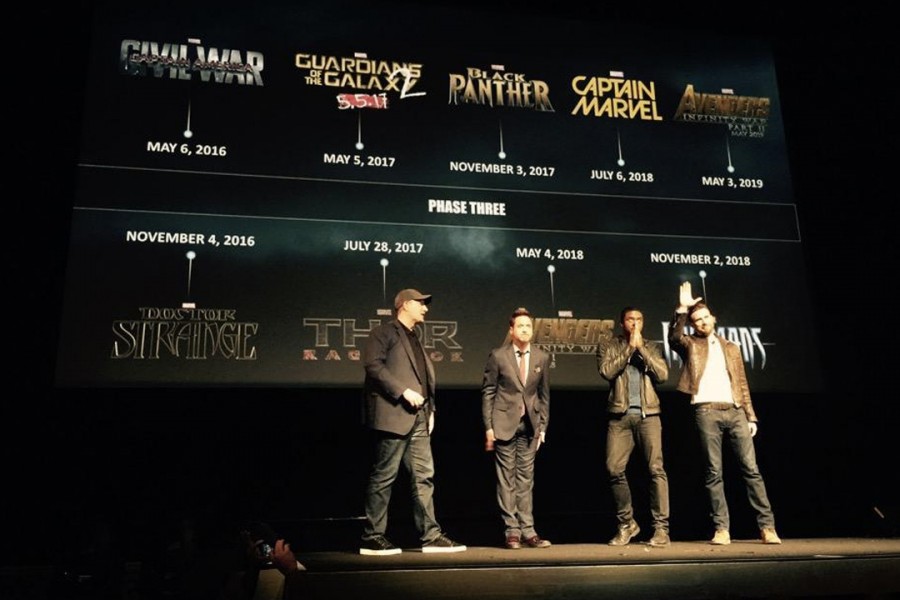 From left to right, Marvel exec Kevin Feige, Robert Downey Junior, Black Panther star Chadwick Boseman, and Chris Evans in front of the phase 3 plans
