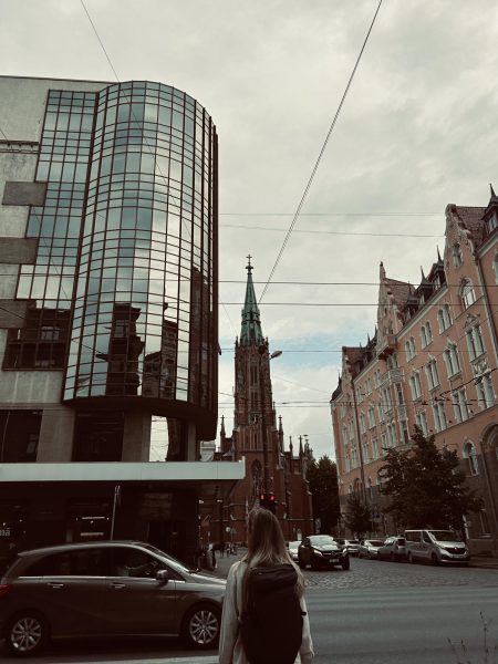 The modern architecture on the left contrasting with the old Latvian architecture on the right.