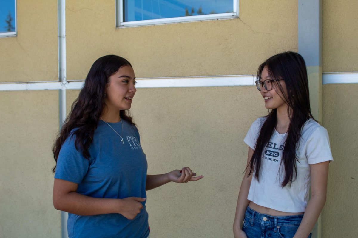 Student Jizelle Lua (left) and peer teacher Julia Nguyen (right) talking and having fun during break.