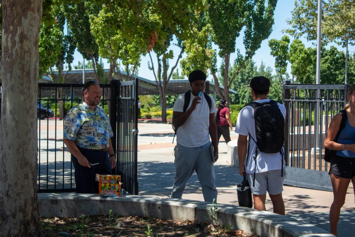 RUSD's Secondary Summer School's Principal Mr. Micheal Knight handing out popsicles at the end of classes to the students.