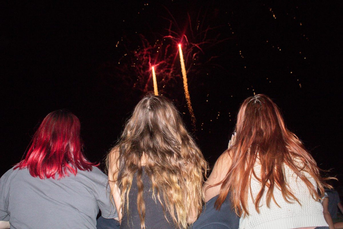 RHS students Daniele Pittman, Brooklyn Sardain , and Elisha Boyd (left to right), watching fireworks at celebrate America event.