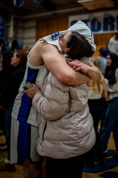 Mark Lavrenov embraces his mother after a tough loss.