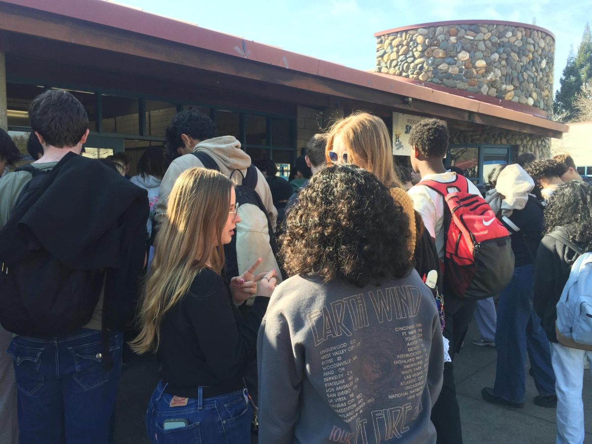 A crowd of RHS students wait to receive their school provided lunch.